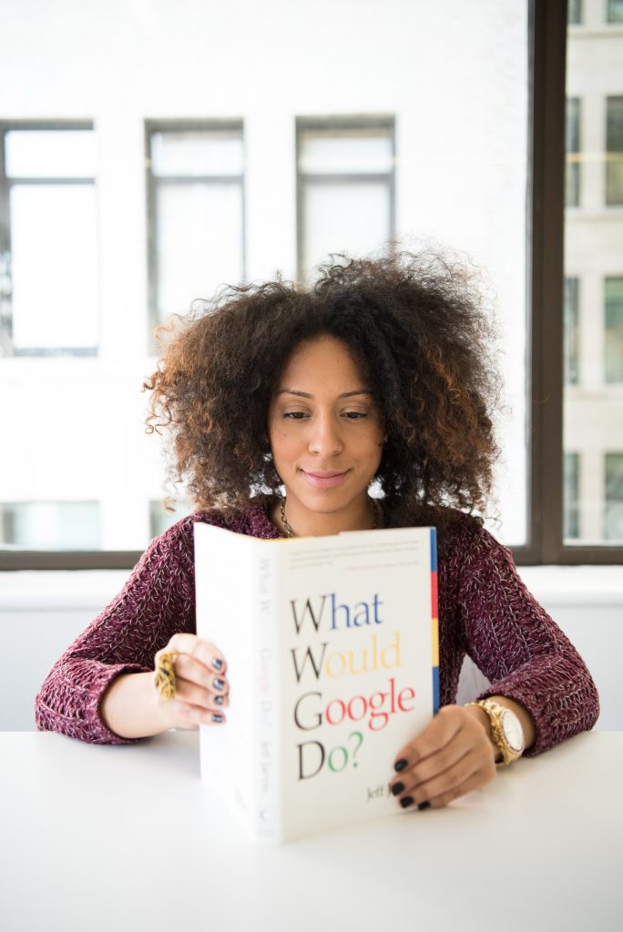 A picture of a lady holding a book, courtesy of Christina Morillo