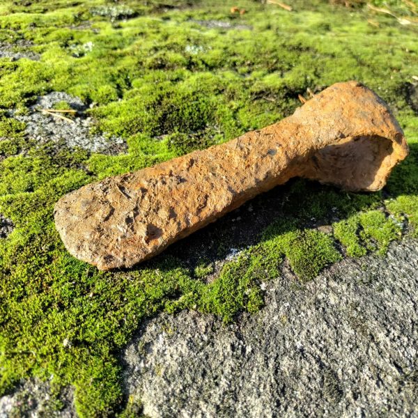 The axe head discovered by the Temple Twelve.